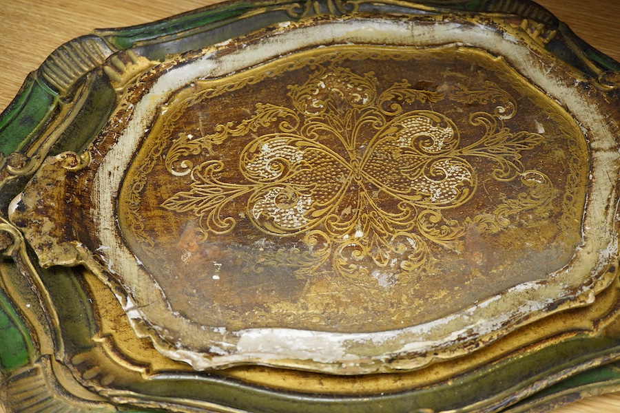 Five Venetian trays, three carved and painted wood examples, largest 57cm wide